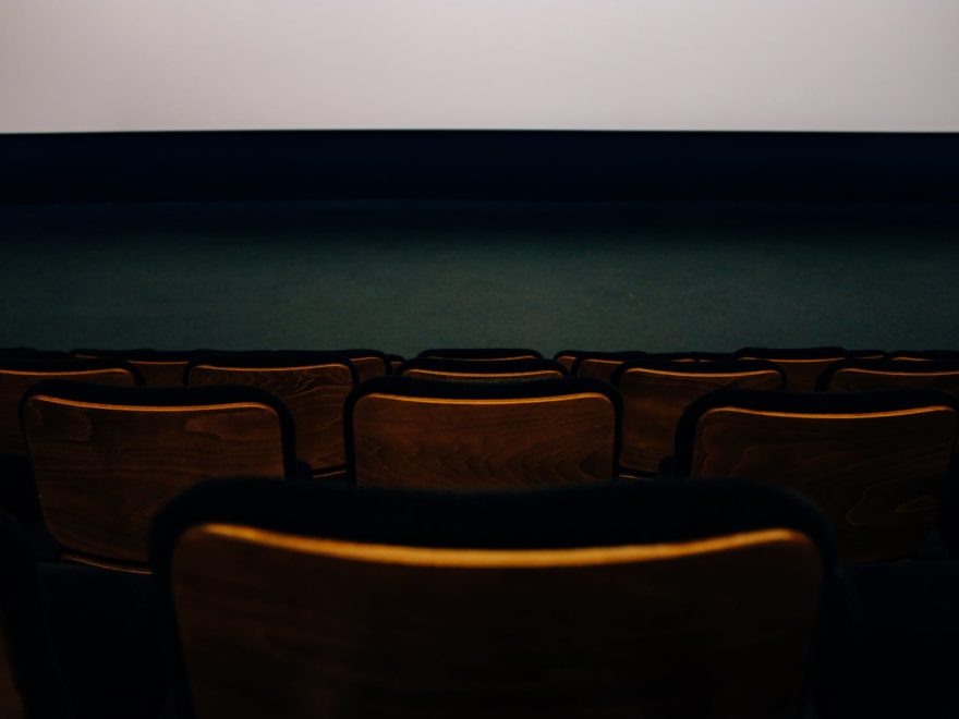 brown chairs in front of white wall