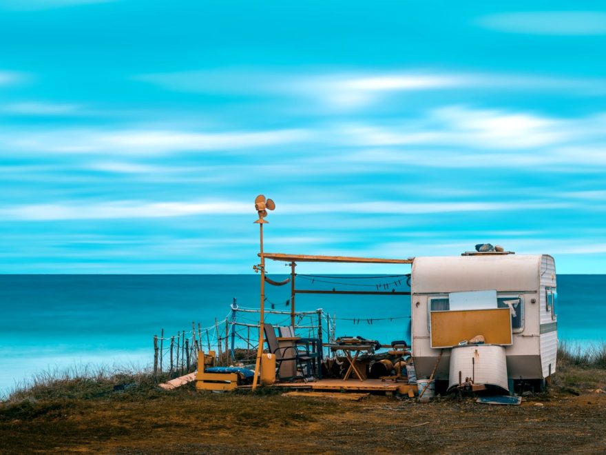 white and brown campervan on beach shore