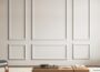 Art3d pre-cut wall molding set for ready-to-assemble wainscoting, white rectangular trim panels on a living room wall