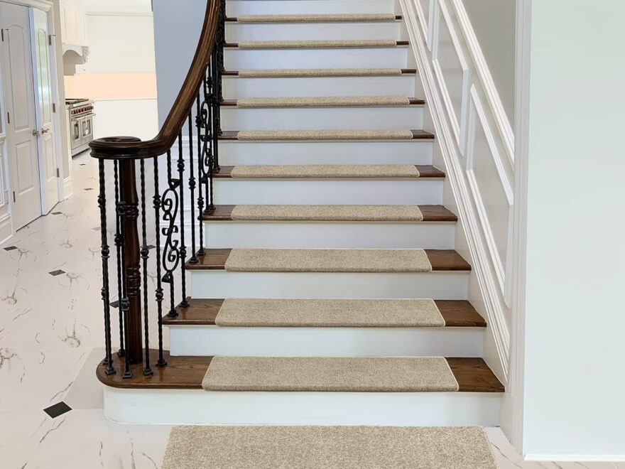 PURE ERA Bullnose Carpet Stair Treads set in beige textured finish on indoor wooden stairs.