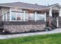 GenStone Faux Stacked Stone Outside Corner Panel with layered stone finish on a home porch base and stair corners