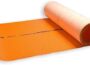 GripRite SL154250LWE synthetic roofing underlayment roll, white printed sheet partially unrolled.