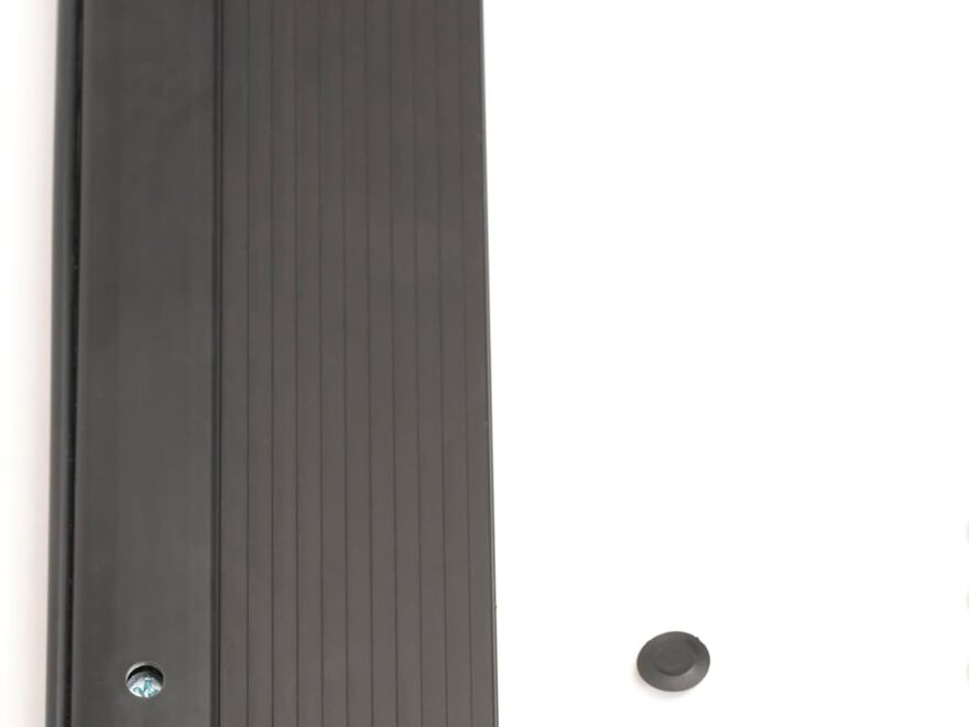 Adjustable aluminum threshold with black ribbed finish and hidden screw design, shown with screw holes and caps.