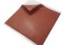 Acoustic Outlet Soundproofing Putty Pads 7 x7 sheet with reddish brown textured surface and white peel-away backing