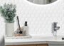 WalDecoo 10-Sheet Hexagon Peel and Stick Backsplash with white textured hex tiles behind bathroom sink