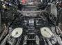 HushMat Bulk Kit black foil sound deadening sheets installed across stripped vehicle interior floor