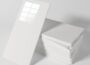 Peel and stick marble PVC waterproof tiles in white square panels with backing sheets stacked on a gray surface