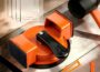 CufEslite Floor Gap Fixer Tool with quick lock handle, orange suction base, black pads, and mallet on wood flooring