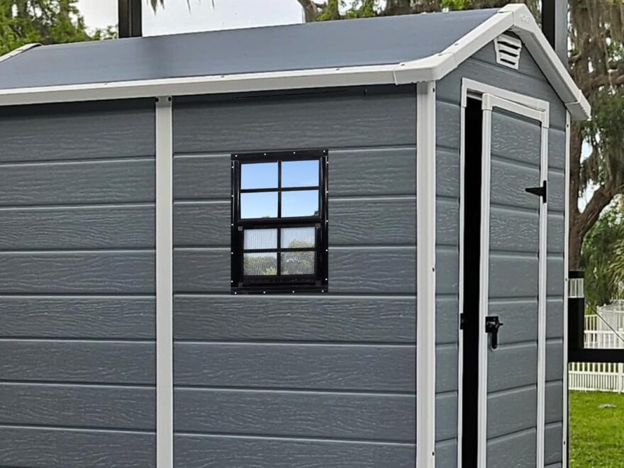 MHirmosy 14 x 21 flush mount shed window with black frame installed on a gray outdoor shed wall