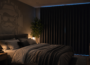 Person resting comfortably with a sleep mask in a calm bedroom setting