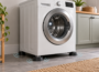 Front-loading washing machine on anti-vibration pads in a laundry room