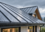 Rain falling on a standing-seam metal roof